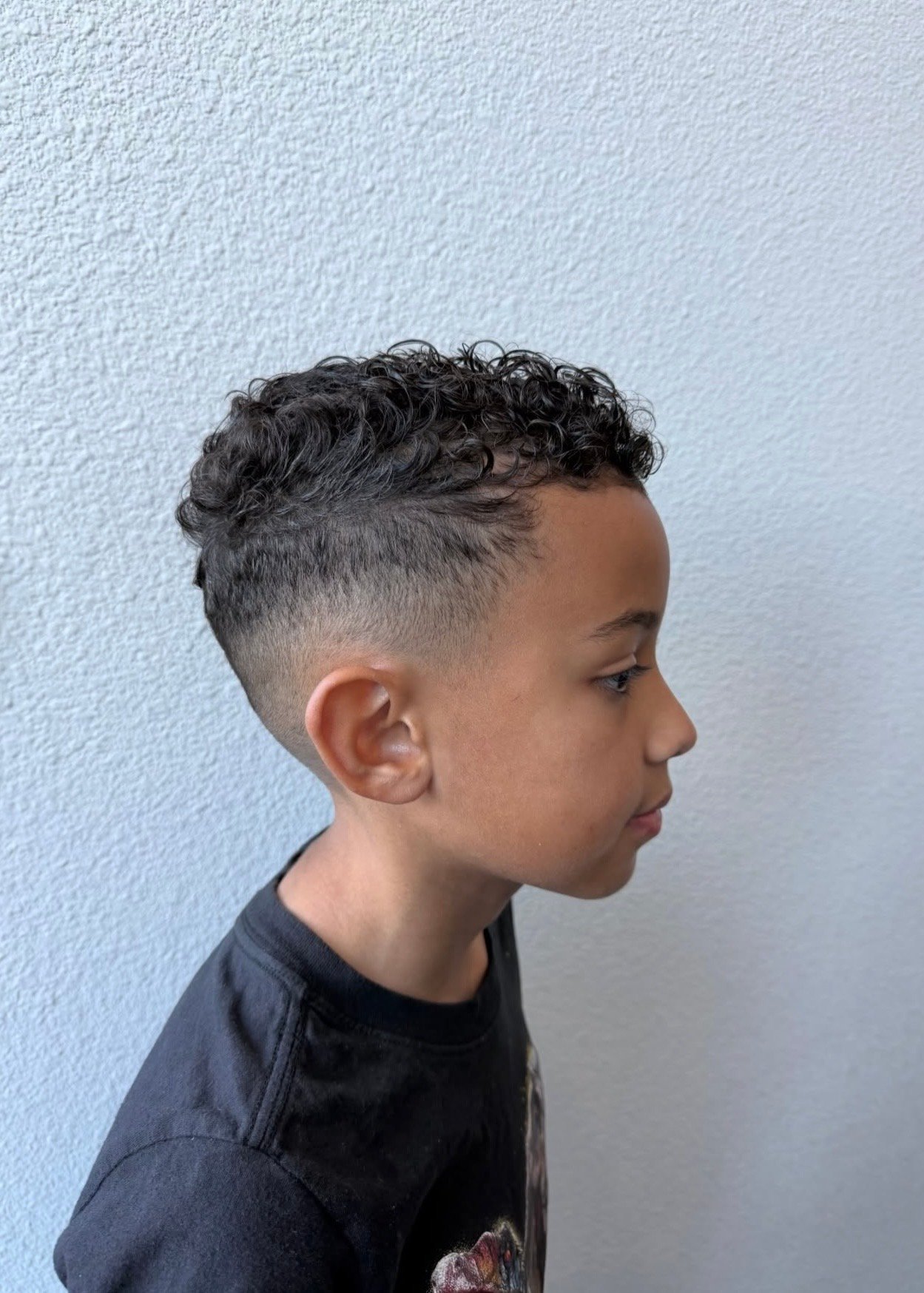 Boy's curly-top fade