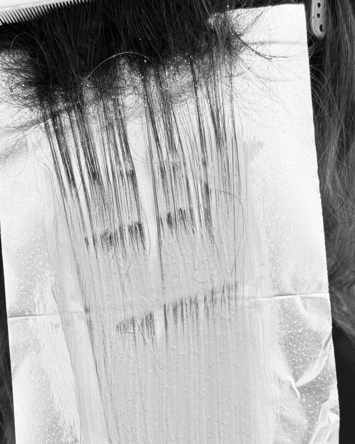 Foil highlights being applied to hair